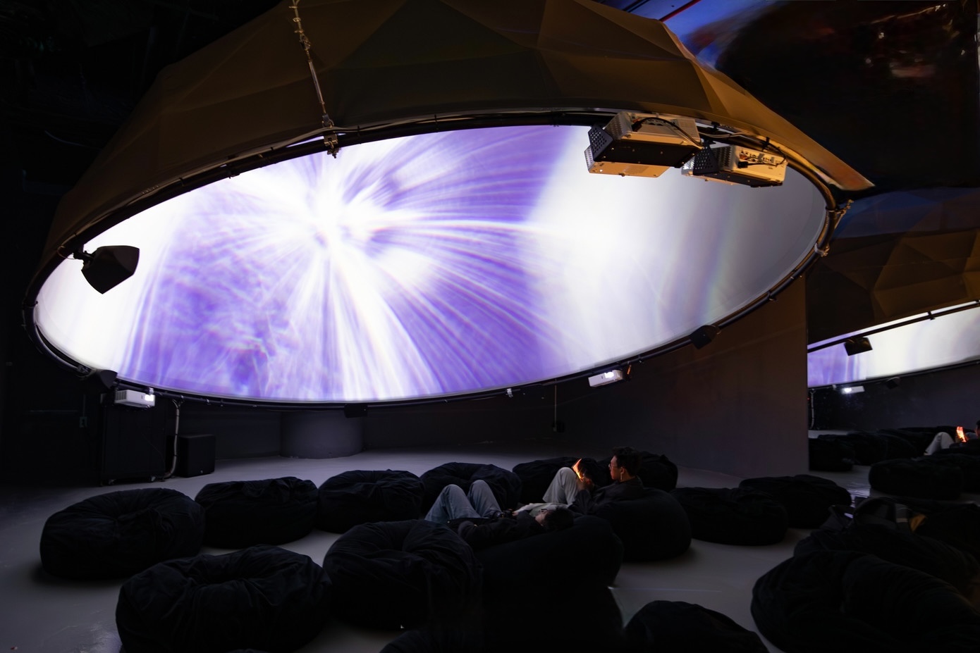 Kids enjoying immersive digital art at X Space Immersive Hanoi