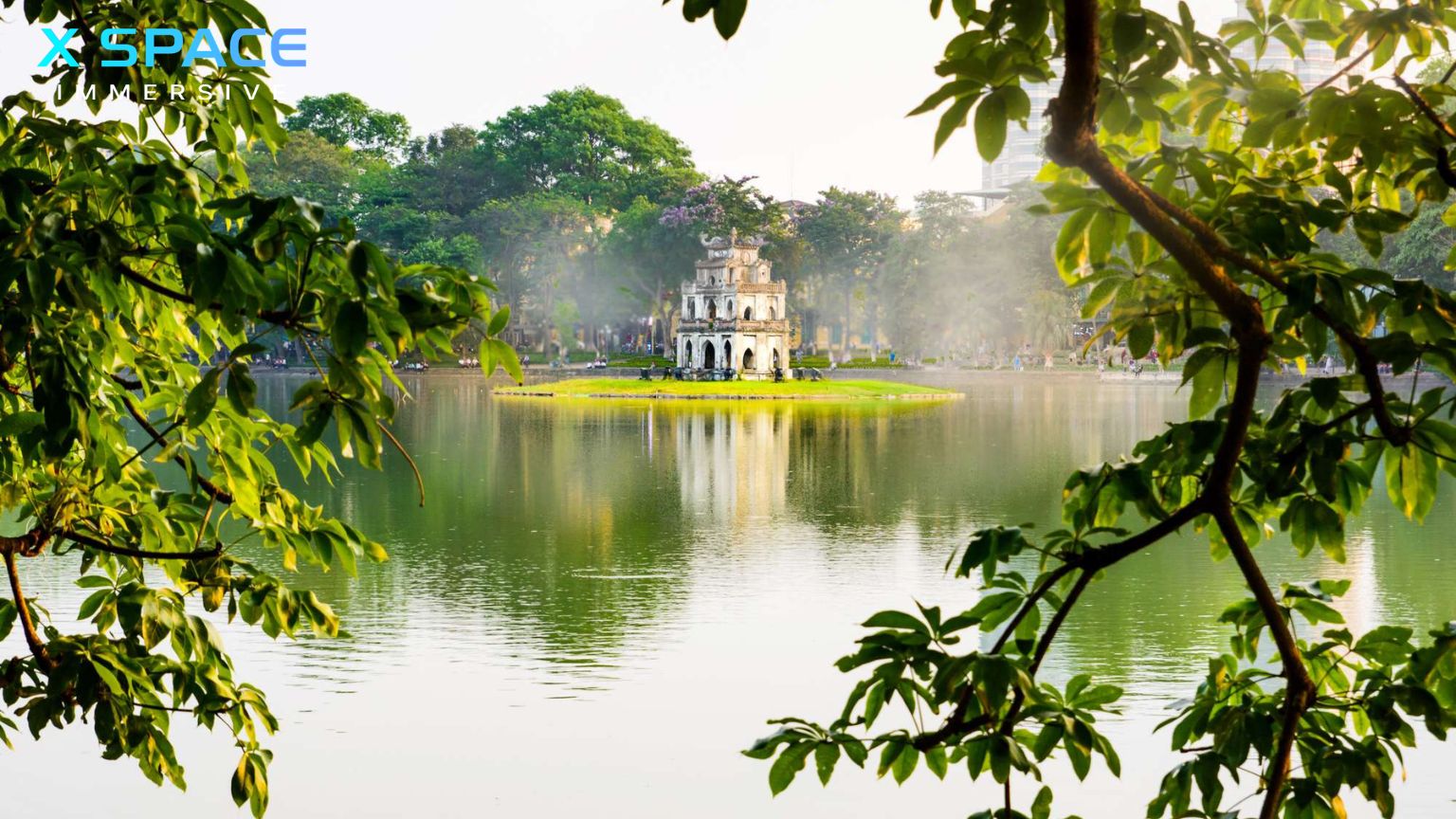Hoan Kiem Lake with Turtle Tower in Hanoi Vietnam during sunrise