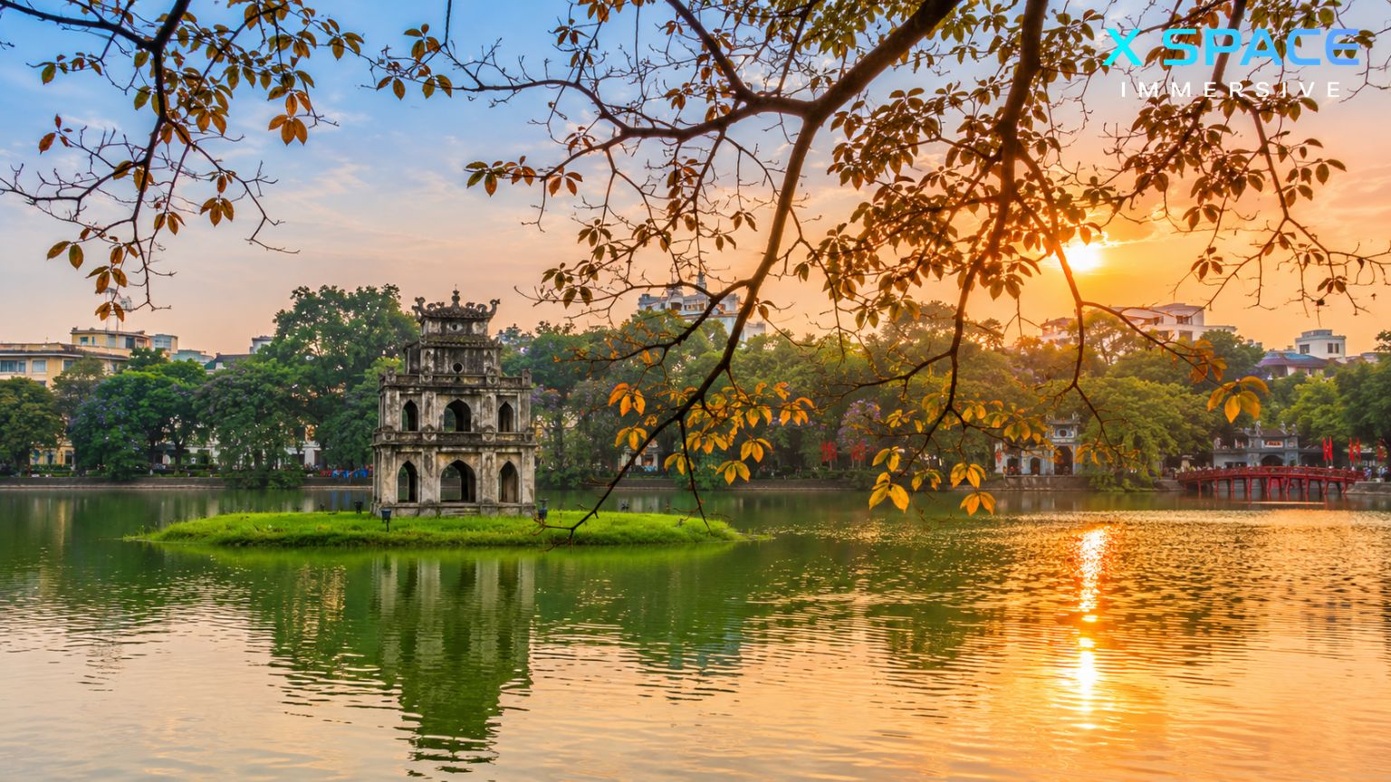 Sunset view of Hoan Kiem Lake with Turtle Tower and Ngoc Son Temple in Hanoi