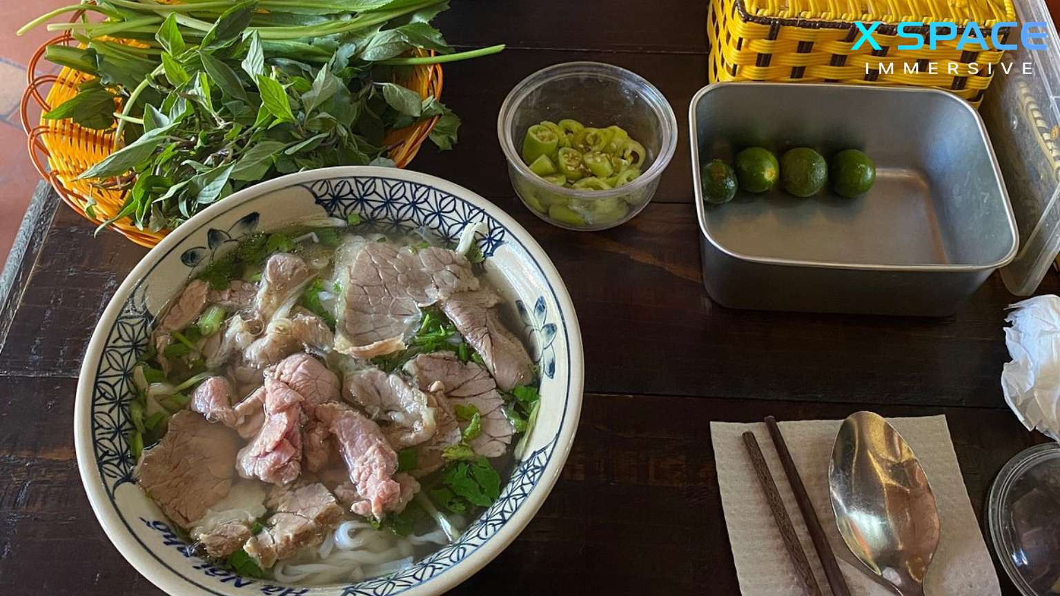 Bowl of pho anh Vietnamese coffee on table in Hanoi