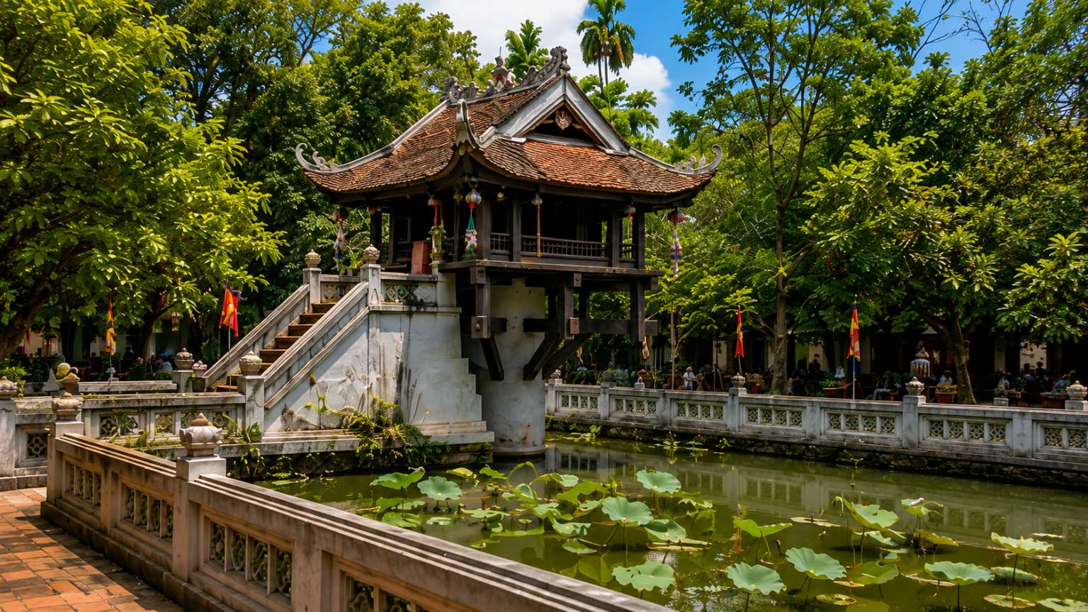 One Pillar Pagoda surrounded by lotus pond and green trees