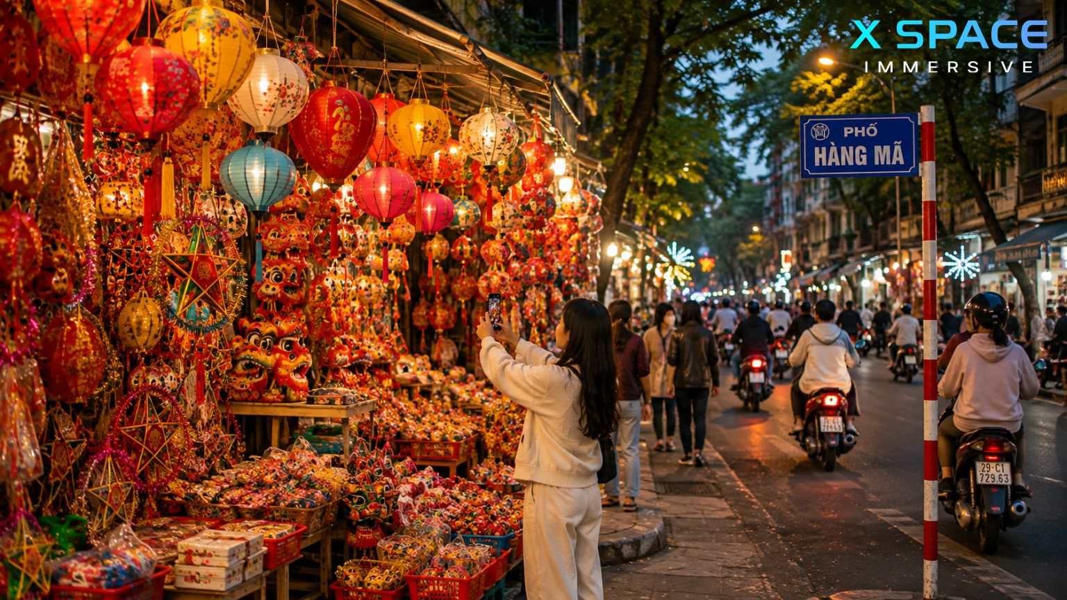 Hang Ma Street Hanoi at night with glowing lanterns, colorful shops and visitors