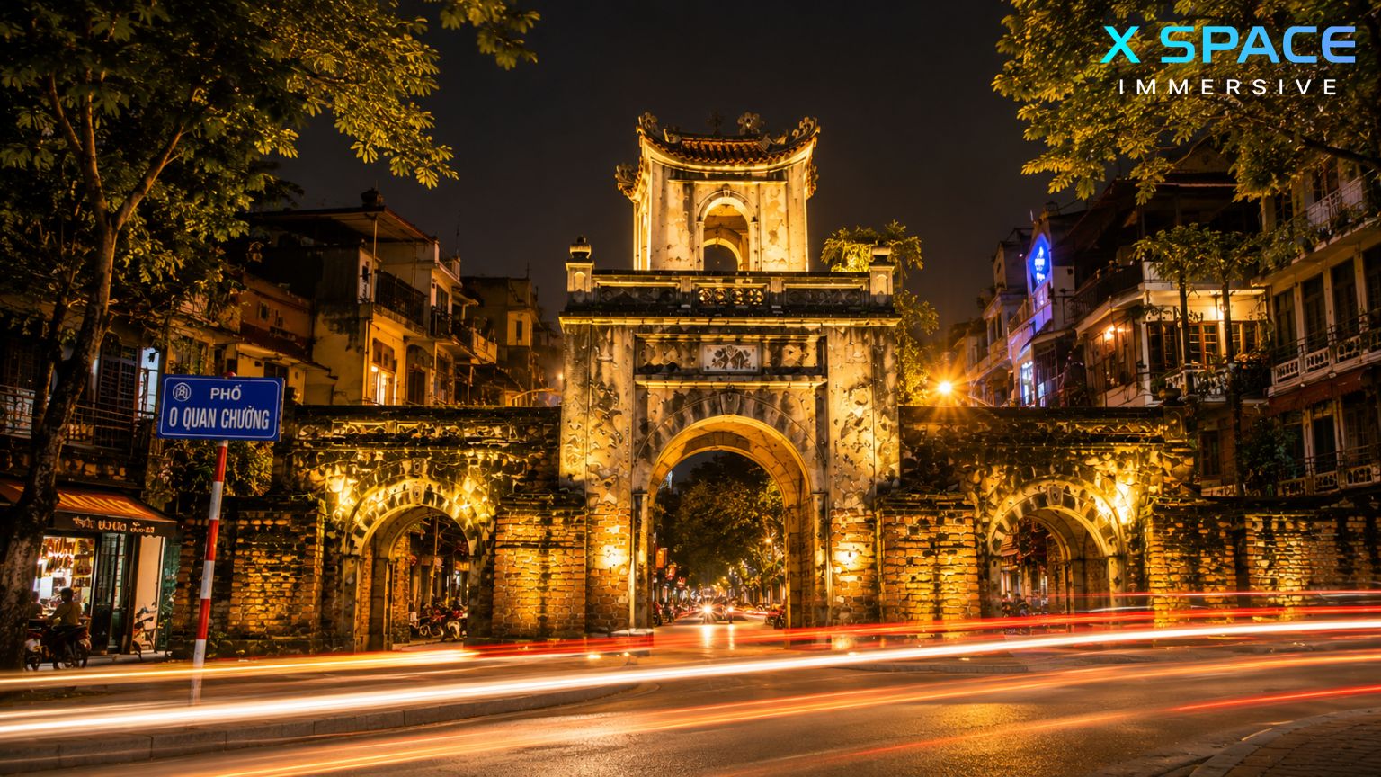 Old City Gate Hanoi illuminated at night, highlighting the historic O Quan Chuong Gate