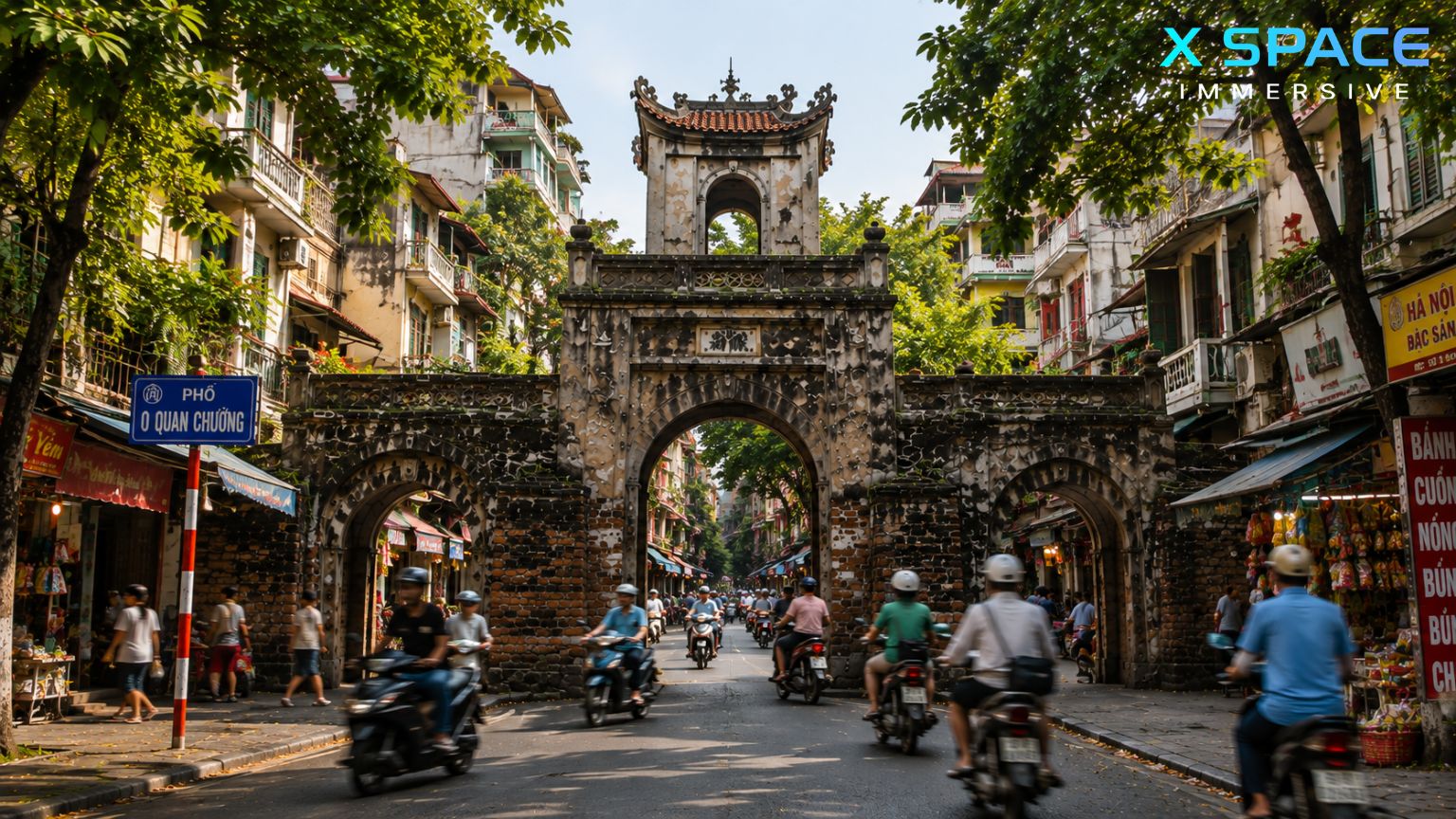 Old City Gate Hanoi surrounded by motorbikes and local life in the Hanoi Old Quarter