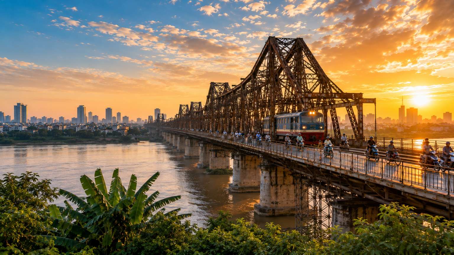 Long Bien Bridge spanning the Red River in Hanoi, Vietnam during golden hour