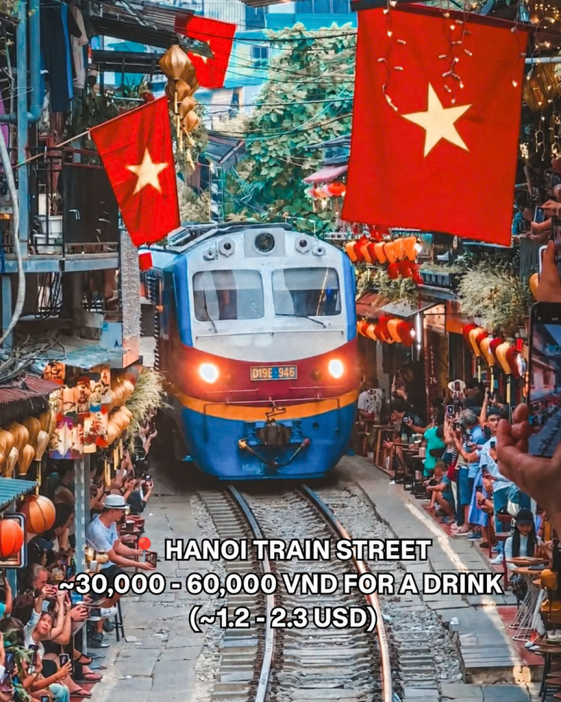 A train passing between the cafes of Hanoi Train Street
