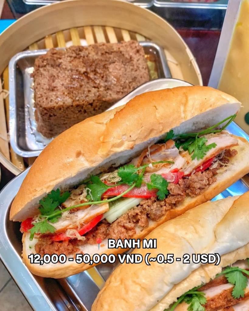 A Hanoi banh mi filled with pate, cold cuts and herbs on a metal tray